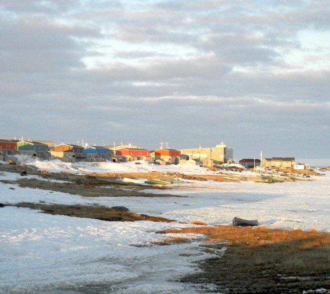 Late evening sunlight illuminates the Nunavik community of Puvirnituq on northern Quebec's Hudson Bay coast. (PHOTO BY JANE GEORGE)