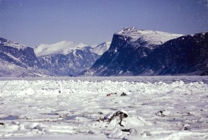 A snowmobile heads out over the sea ice in Pangnirtung's fiord in May 1993. (PHOTO BY JANE GEORGE)