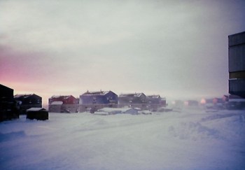 A view down a street in Puvirnituq with the Inuulitsivik Health Centre to the right. (PHOTO BY JANE GEORGE)