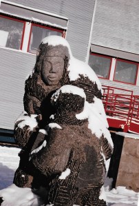 This large carving of a mother and her child made by Peter Ittukallak stands outside the Iguarsivik School in Puvirnituq. (PHOTO BY JANE GEORGE)