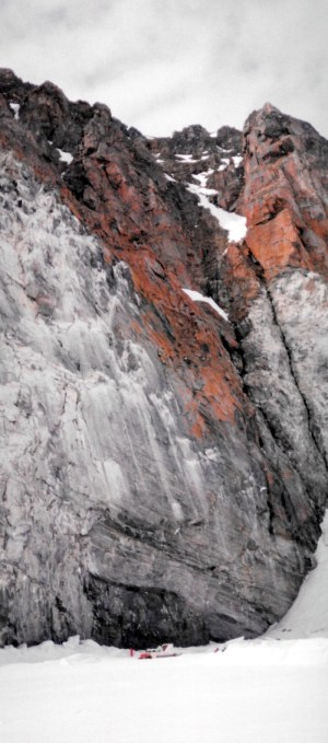 Our komatik and snowmobile by the towering cliffs of Bylot Island, home to hundreds and thousands of migratory birds. (PHOTO BY JANE GEORGE)