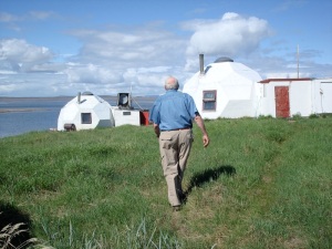 Glenn Warner, who died in 2014 at the age of 80. walks towards two of the three remaining domes at Bathurst Inlet in 2009.